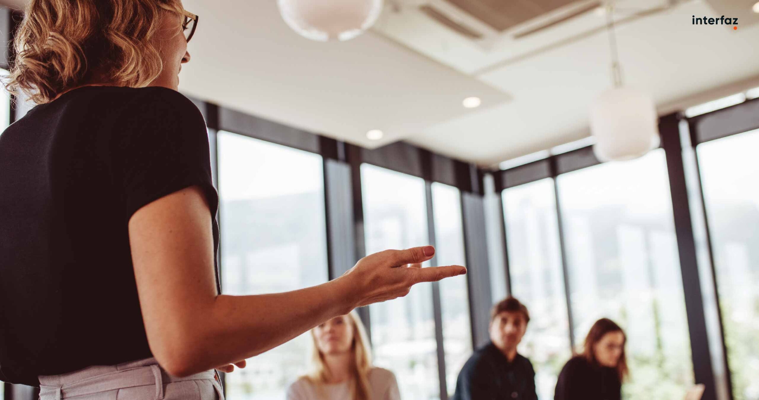 Businesswoman making a presentation to her colleagues in office